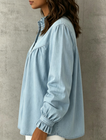 Loose-fit Denim Shirt Featuring A Stand Collar With Lettuce-edge Trim, A Partial Button Placket, Front Shirring, And Long Sleeves With Ruffled, Cinched Cuffs